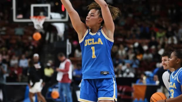 Kiki Rice shoots the basketball in warmups.